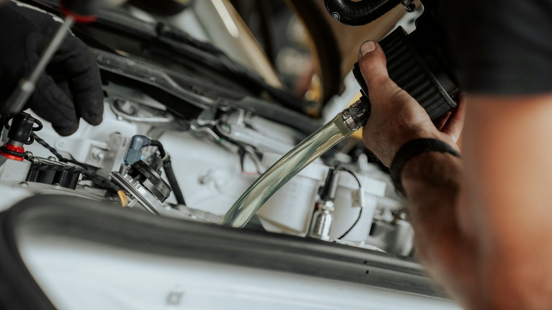 Real mechanic checking a vehicle engine