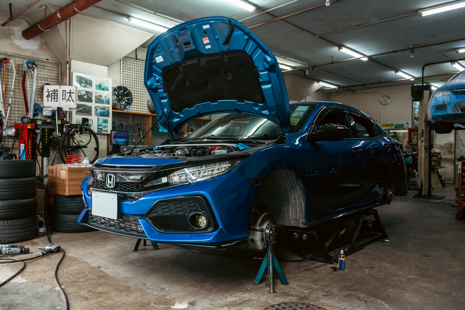 Honda Civic inside an automotive workshop